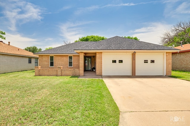 2509 1st Atlas St, San Angelo, TX 76905 - ranch-style house with driveway, a garage, brick siding, and roof with shingles