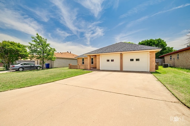 2509 1st Atlas St, San Angelo, TX 76905 - ranch-style home with cooling unit, a garage, brick siding, and a front lawn