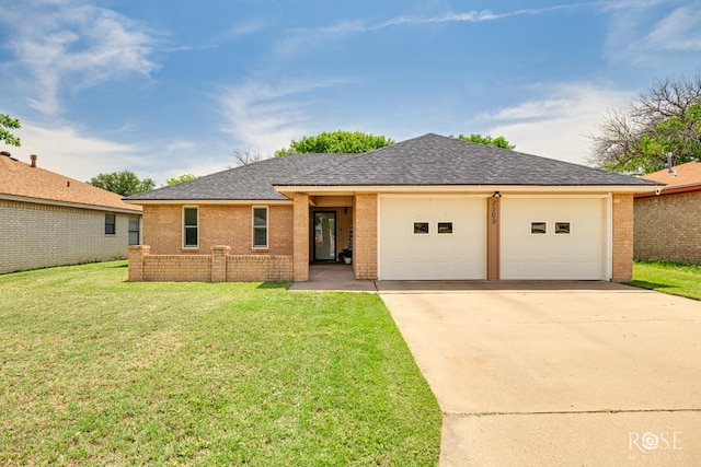 2509 1st Atlas St, San Angelo, TX 76905 - single story home with a garage, concrete driveway, brick siding, and a shingled roof