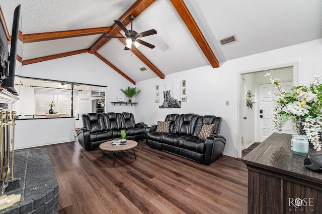2509 1st Atlas St, San Angelo, TX 76905 - living room featuring a ceiling fan, dark wood finished floors, and a textured ceiling
