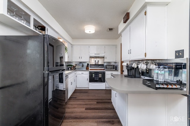 2509 1st Atlas St, San Angelo, TX 76905 - kitchen featuring electric range oven, freestanding refrigerator, under cabinet range hood, a peninsula, and white cabinets
