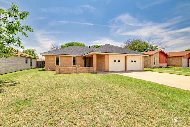 2509 1st Atlas St, San Angelo, TX 76905 - ranch-style house with a garage, brick siding, driveway, and roof with shingles