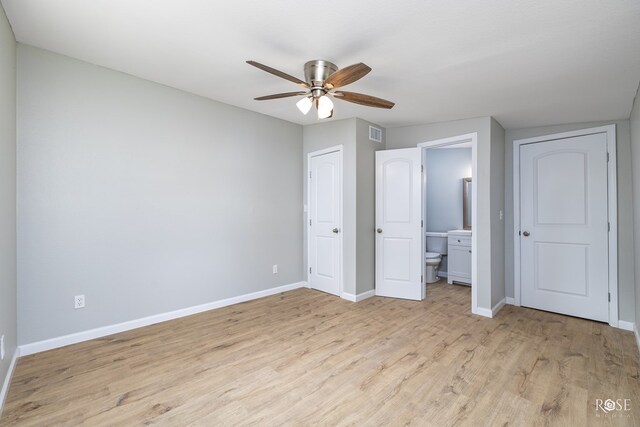 unfurnished bedroom featuring ceiling fan, connected bathroom, and light hardwood / wood-style flooring