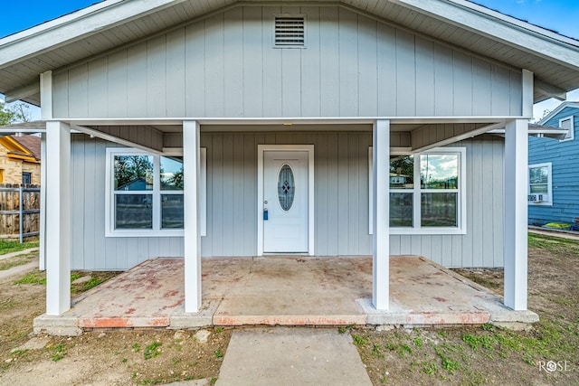 entrance to property with covered porch