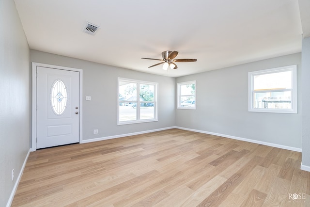 foyer entrance featuring ceiling fan and light hardwood / wood-style floors