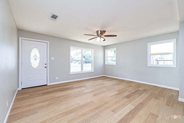 foyer entrance featuring ceiling fan and light hardwood / wood-style floors