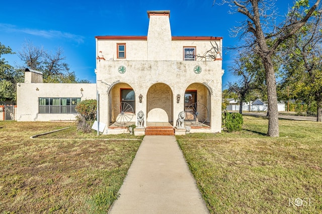 2318 Dallas St, San Angelo, TX 76901 - view of front of property featuring stucco siding, a chimney, and a front lawn