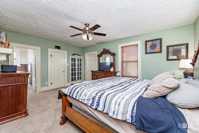2318 Dallas St, San Angelo, TX 76901 - carpeted bedroom with a ceiling fan and a textured ceiling