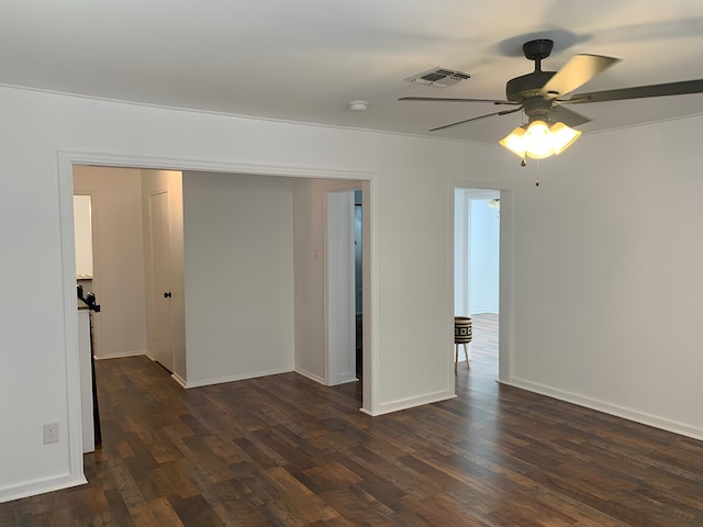 unfurnished room with dark wood-type flooring and ceiling fan