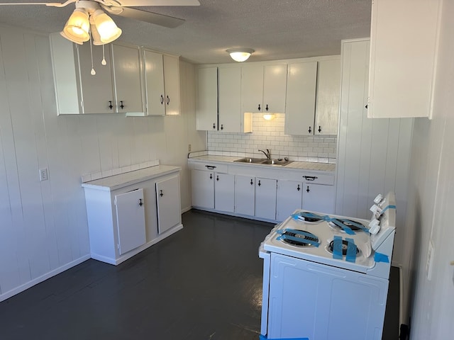 kitchen with sink, white cabinets, white electric range oven, ceiling fan, and a textured ceiling