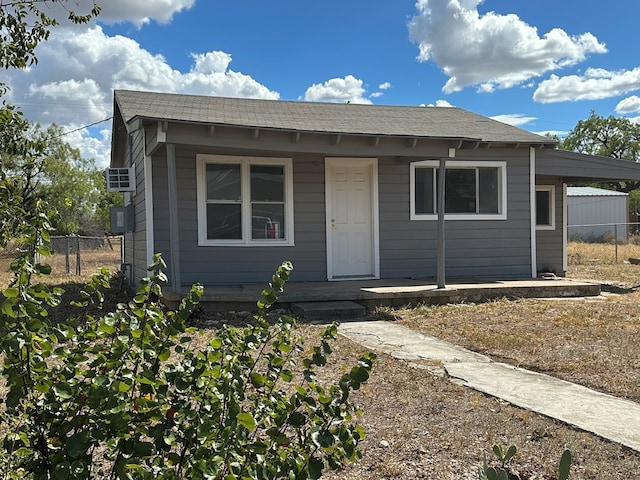 view of front of home featuring a carport and covered porch