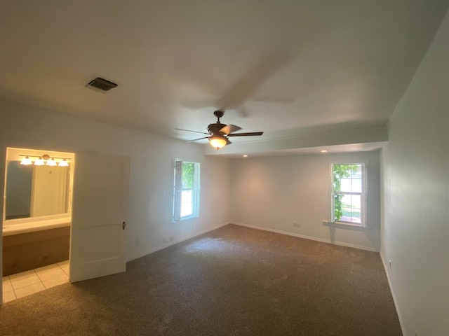 1001 S David St, San Angelo, TX 76903 - empty room featuring ceiling fan, carpet, and baseboards