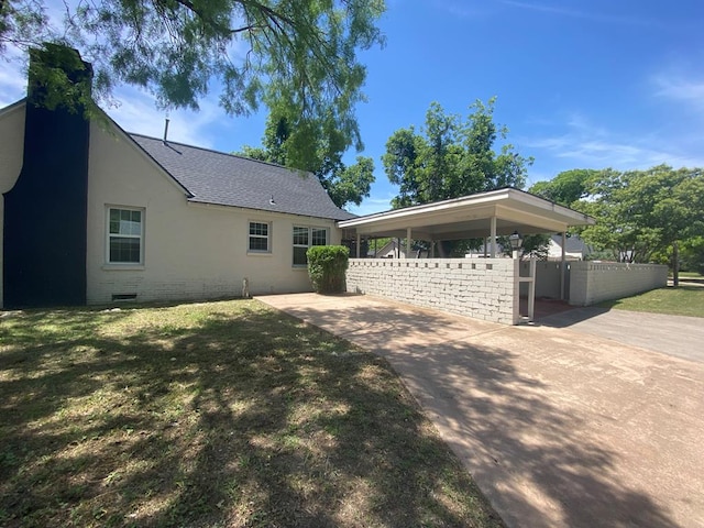 1001 S David St, San Angelo, TX 76903 - view of front facade featuring fence, a shingled roof, crawl space, a carport, and a chimney