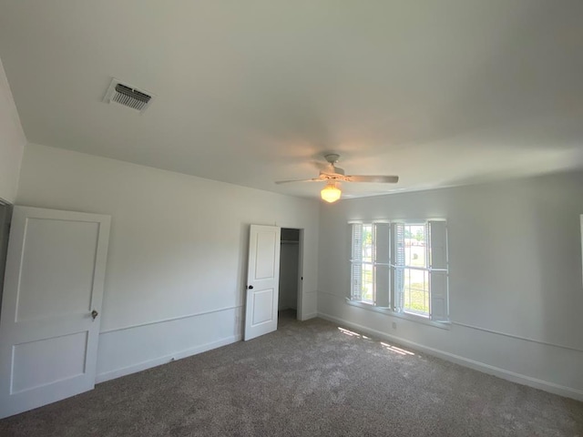 1001 S David St, San Angelo, TX 76903 - unfurnished bedroom with carpet floors, a closet, baseboards, and ceiling fan