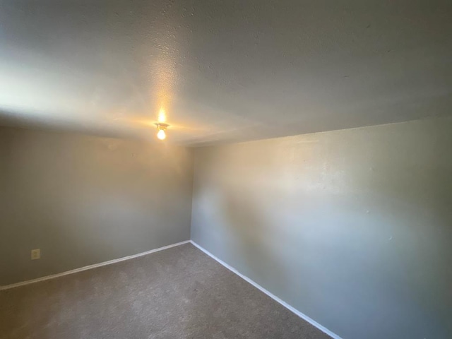 1001 S David St, San Angelo, TX 76903 - carpeted spare room featuring baseboards