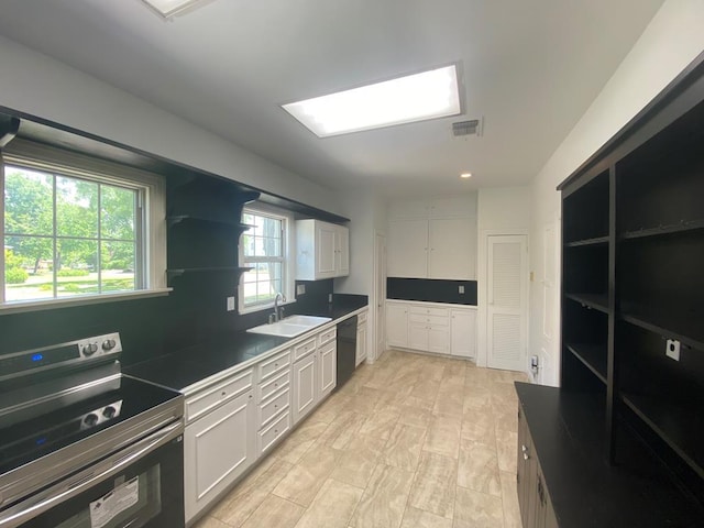 1001 S David St, San Angelo, TX 76903 - kitchen featuring electric range, a sink, dishwasher, open shelves, and white cabinets