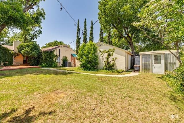 1510 Shafter St, San Angelo, TX 76901 - view of green lawn featuring an exterior structure and an outdoor structure
