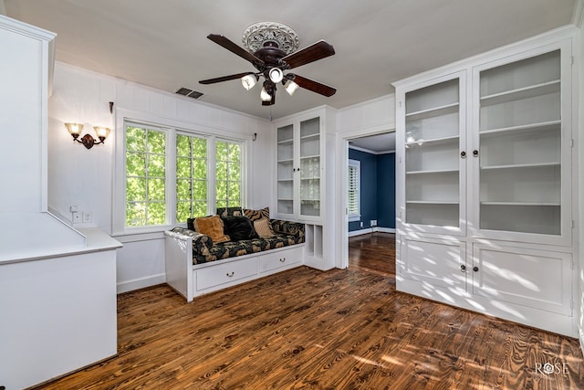 1510 Shafter St, San Angelo, TX 76901 - living area with ceiling fan, dark wood finished floors, and ornamental molding