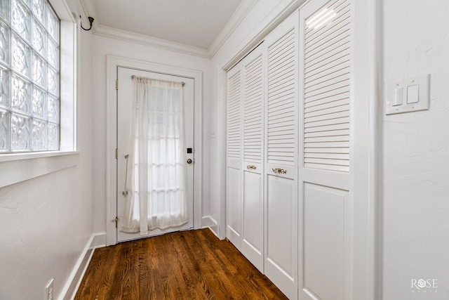 1510 Shafter St, San Angelo, TX 76901 - doorway featuring crown molding and dark wood finished floors