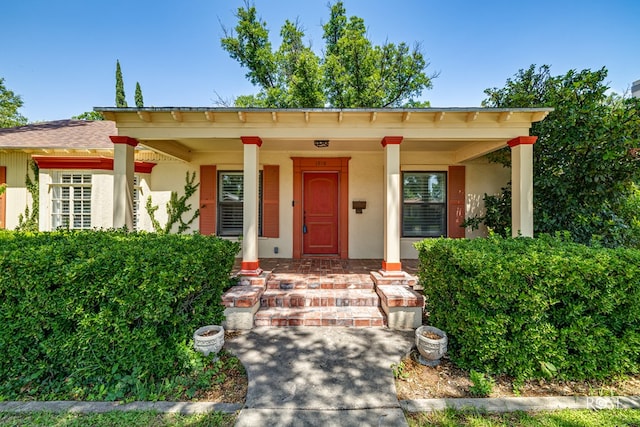 1510 Shafter St, San Angelo, TX 76901 - view of front of home featuring stucco siding and a porch