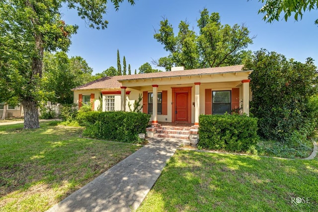 1510 Shafter St, San Angelo, TX 76901 - view of front facade with a porch, stucco siding, and a front yard