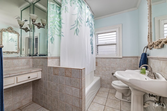 1510 Shafter St, San Angelo, TX 76901 - bathroom with tile walls, tile patterned flooring, ornamental molding, plenty of natural light, and shower / bath combo