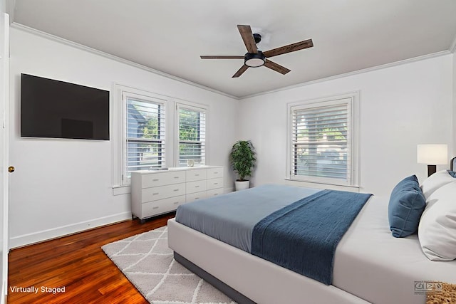 1510 Shafter St, San Angelo, TX 76901 - bedroom featuring crown molding, dark wood-type flooring, and ceiling fan