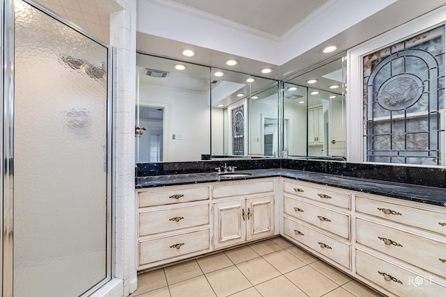 1510 Shafter St, San Angelo, TX 76901 - bathroom with ornamental molding, tile patterned flooring, a shower stall, vanity, and recessed lighting