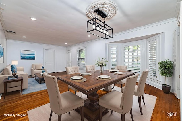 1510 Shafter St, San Angelo, TX 76901 - dining space featuring crown molding, recessed lighting, and wood finished floors