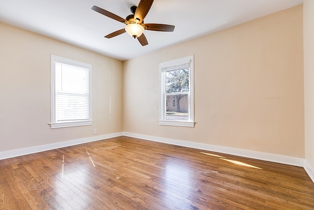 spare room with wood-type flooring and ceiling fan