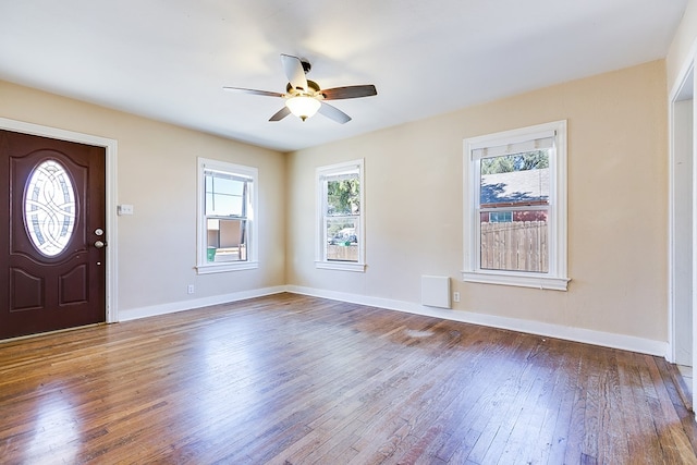 foyer entrance with ceiling fan and dark hardwood / wood-style flooring