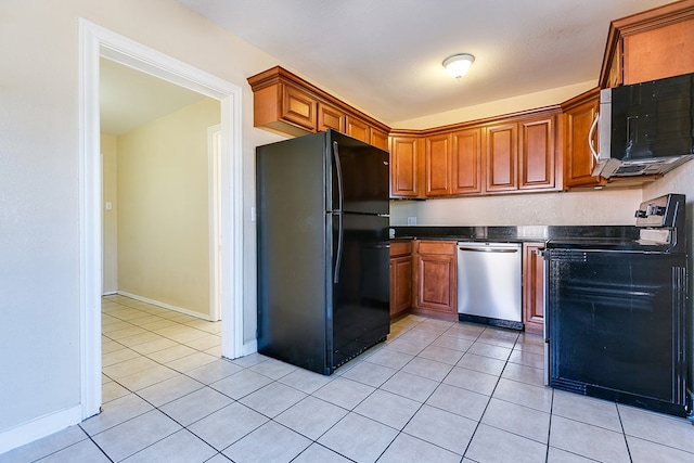 kitchen featuring light tile patterned flooring and stainless steel appliances