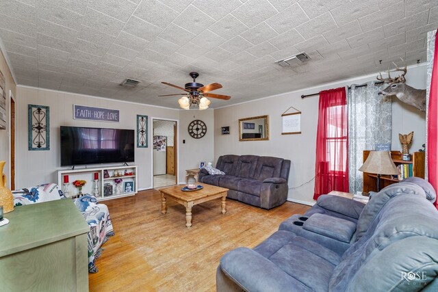 living room featuring wood-type flooring and ceiling fan