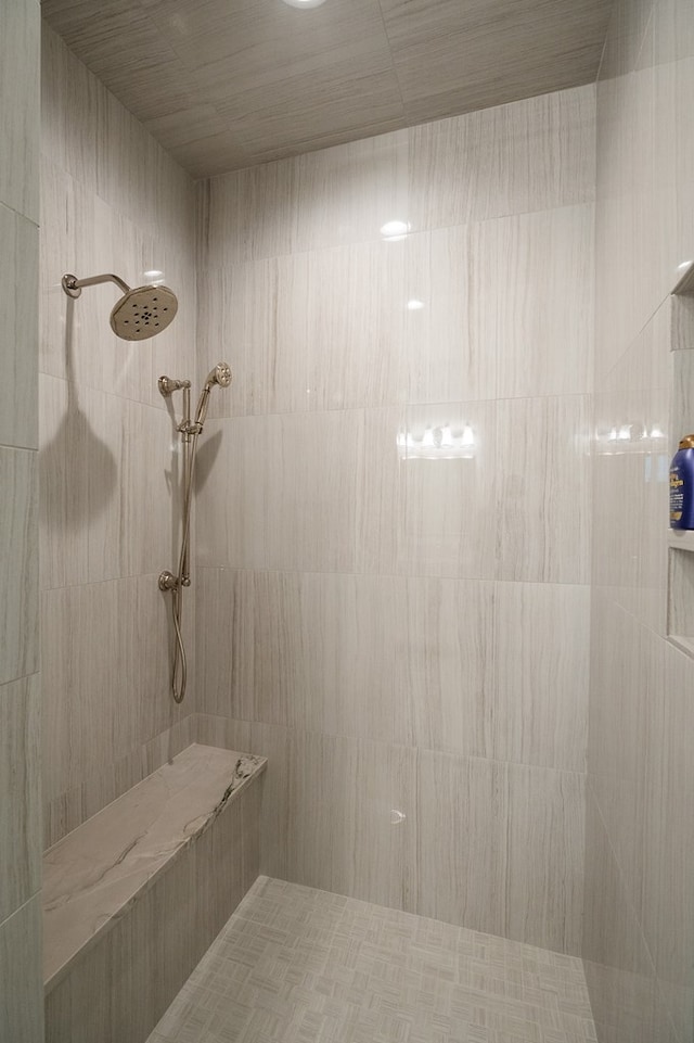 bathroom with tiled shower