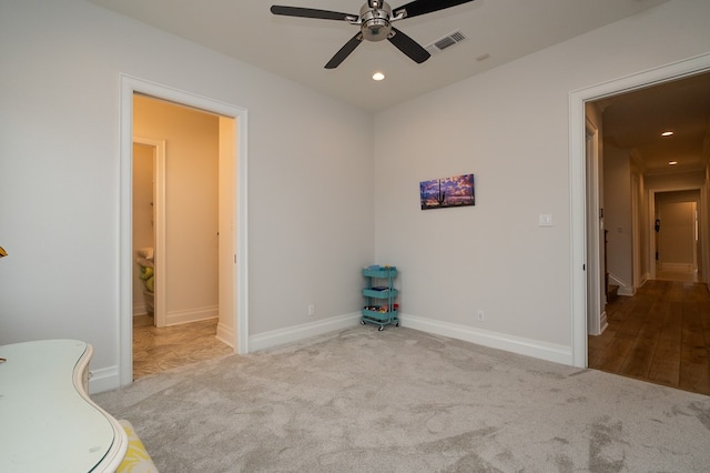 unfurnished bedroom featuring light carpet