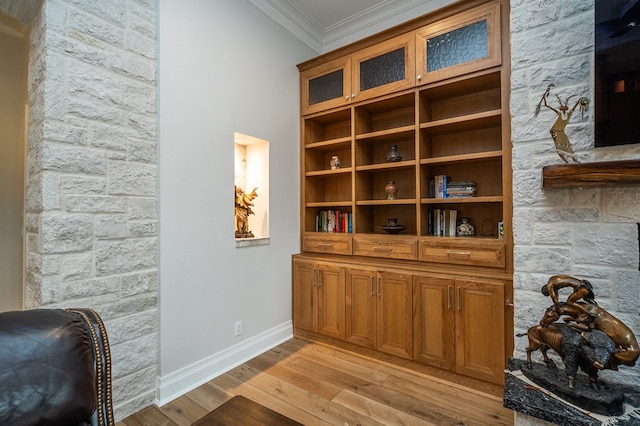 room details with hardwood / wood-style floors and crown molding