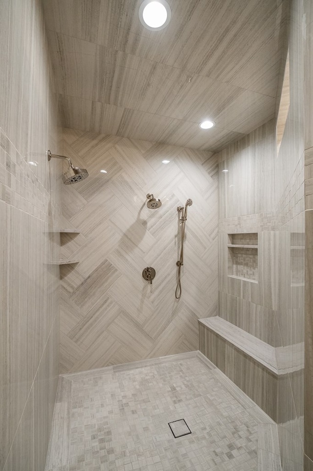 bathroom with a tile shower