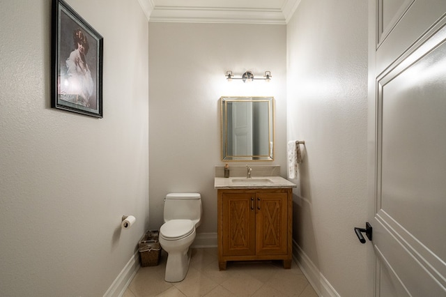 bathroom featuring vanity, tile patterned floors, ornamental molding, and toilet