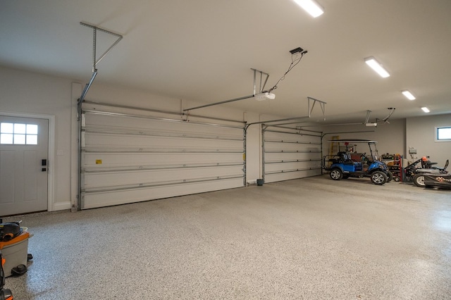 garage featuring a garage door opener