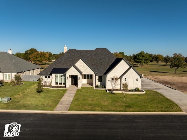 view of front facade with a front lawn