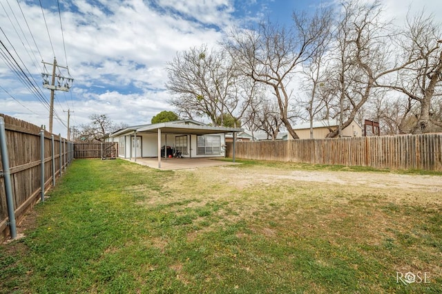 1726 S Park St, San Angelo, TX 76901 - view of yard with a fenced backyard and a carport