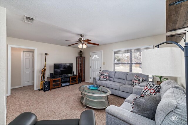1726 S Park St, San Angelo, TX 76901 - living area with carpet, visible vents, baseboards, and ceiling fan