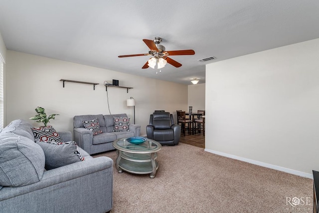 1726 S Park St, San Angelo, TX 76901 - carpeted living room with baseboards, visible vents, and ceiling fan