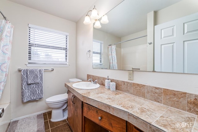 1726 S Park St, San Angelo, TX 76901 - bathroom with tile patterned flooring, toilet, a shower with curtain, and vanity