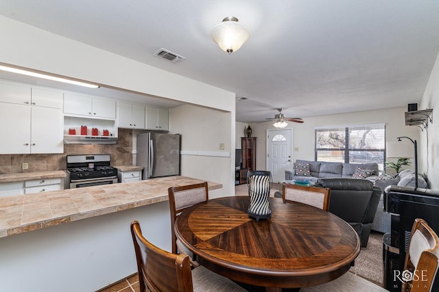 1726 S Park St, San Angelo, TX 76901 - dining area with a ceiling fan and visible vents