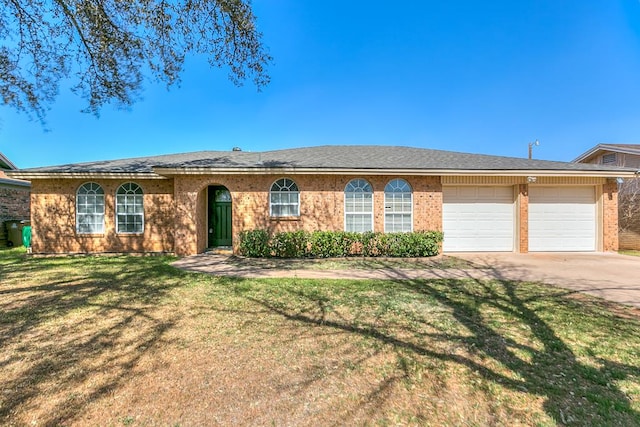 ranch-style home with a front yard, an attached garage, brick siding, and driveway