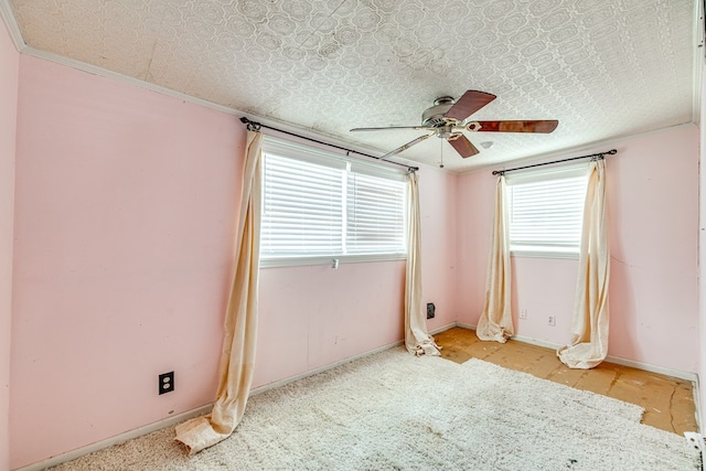 unfurnished room featuring crown molding and ceiling fan