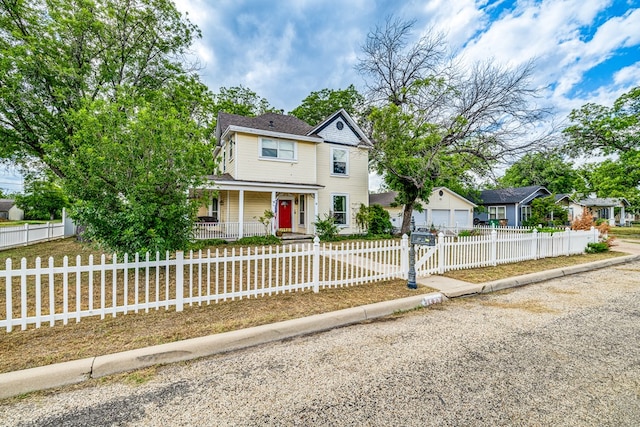 view of front of property with a garage and covered porch