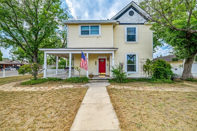 view of front of property featuring a porch and a front yard