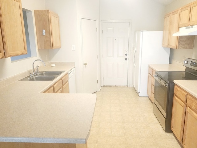 kitchen with white appliances, light brown cabinets, a sink, and under cabinet range hood